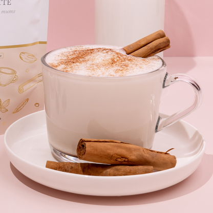 Made to Milk creamy chai latte package with a cup of latte on a pink background