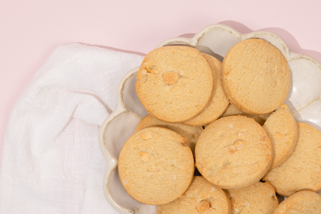 Cookies on a decorative plate with a soft pink background