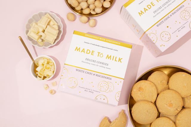 Cookies with packaging and ingredients on a pink background