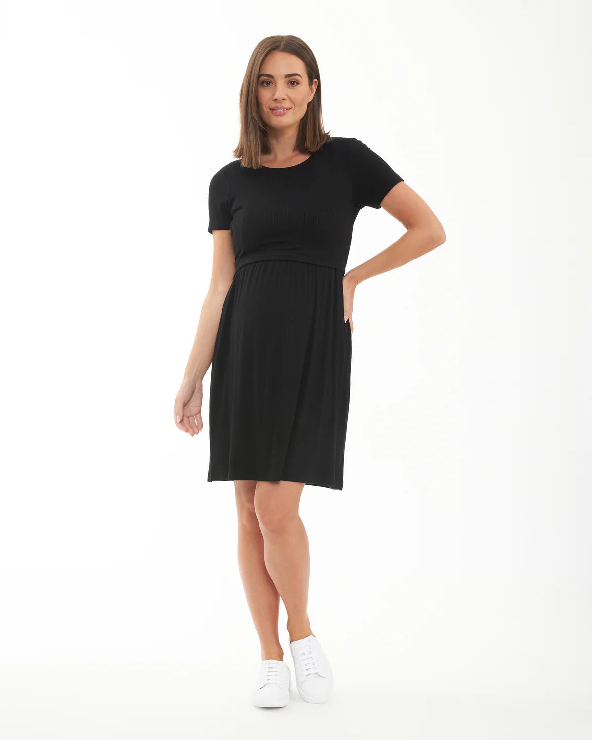 Pregnant Woman wearing a black maternity dress on a white background