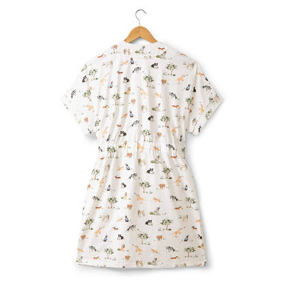 White dress with animal pattern on a hanger against a white background