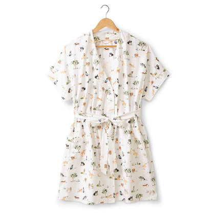 Floral-patterned robe on a wooden hanger against a white background