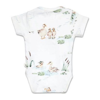 Baby onesie with duckling pattern on a white background