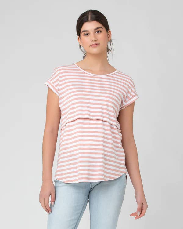 Pregnant Woman wearing a pink and white striped t-shirt against a plain background