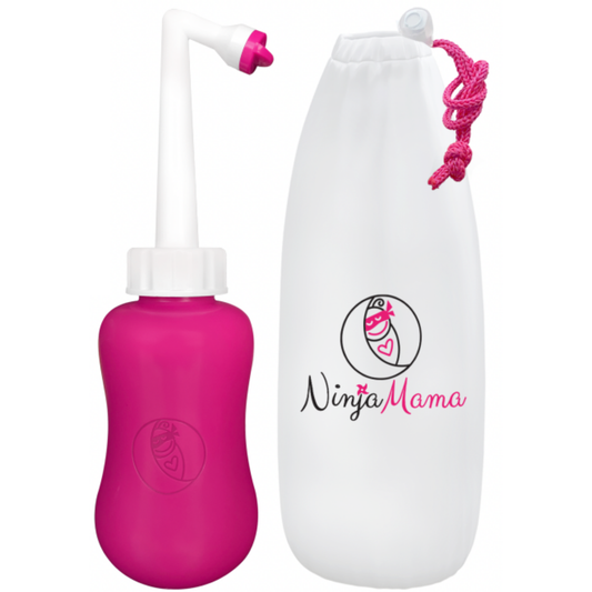 Pink and white postpartum perineal bottle with Ninja Mama logo on a white background